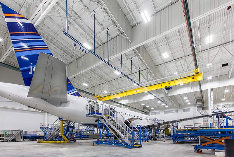 Airplane sitting inside Lufthansa Technik Heavy Maintenance Facility.